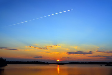 Plane flies to the West. Lake Engozero, North Karelia, Russia