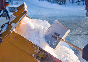 Bucket filled with snow shovel