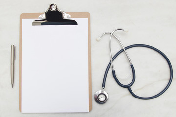 medical folder blank on your desktop with the stethoscope, top view