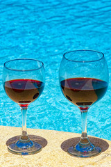 Glass of wine at swimming pool