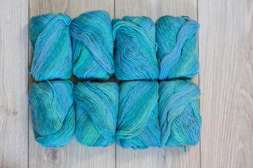 Luxury wool yarn on a wooden background