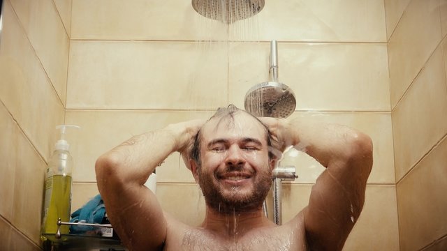 Happy Handsome Man Taking Shower Close-up Shot