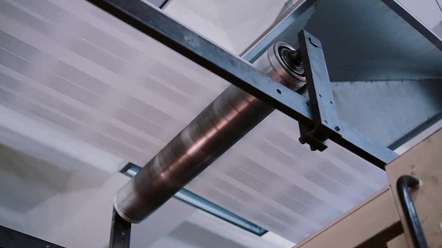 Printing establishment detail on production line with sound. Newspapers in the process of publishing with sound