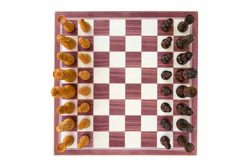 boxwood chessboard with all pieces on white background wide angle shot