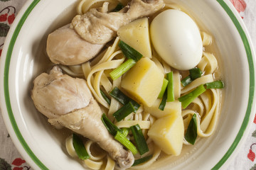 caldo de gallina, the classic Peruvian chicken noodle soup