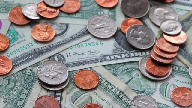 A Pile Of Coins And Cash. Shot Slider.