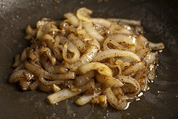 onions browning in a wok