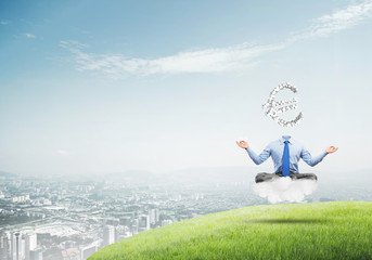 Headless meditating businessman
