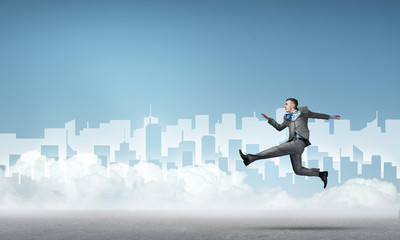 Businessman jumping high