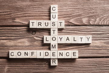 Conceptual business keywords on table with elements of game making crossword