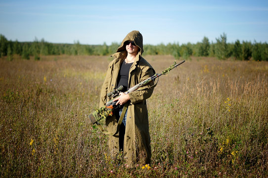 A man with a gun in his hands