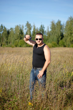 A man with a gun in his hands