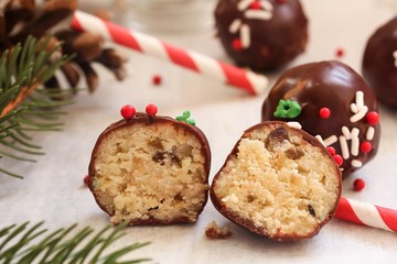 Fototapeta na wymiar Christmas cake balls covered in chocolate Ganache, selective focus