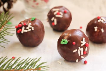Christmas cake balls covered in chocolate Ganache, selective focus