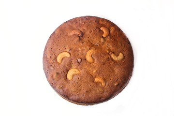 Christmas fruit cake isolated on white, top down view