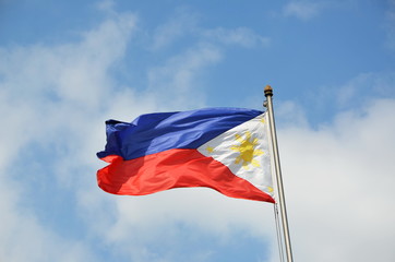 
National flag of Philippines on the sky background 