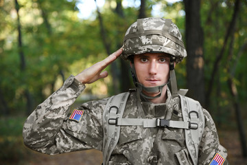 Soldier in camouflage taking salute