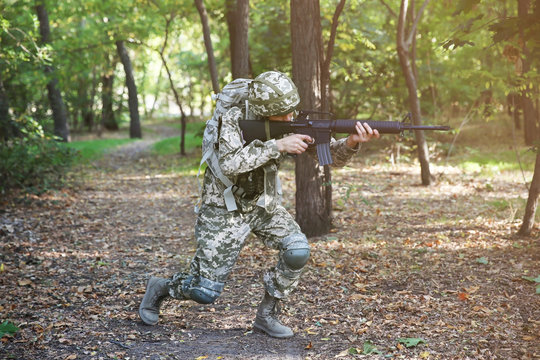 Soldier during military manoeuvre in forest
