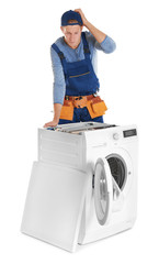 Plumber with washing machine on white background