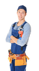 Plumber with tools on white background