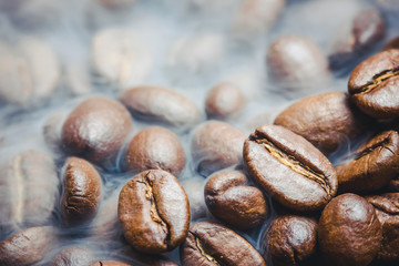 Artistic coffee seeds with shallow depth of field background.