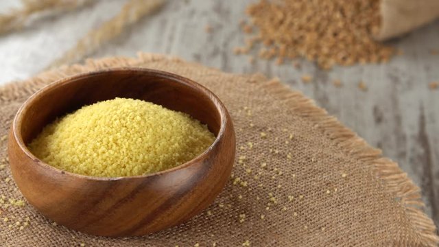 Raw couscous on burlap rotating. Seamless loopable. Prores 4K.