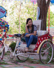 Portrait asia woman with three-wheeler