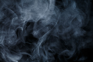 Abstract smoke Weipa. Personal vaporizers fragrant steam. The concept of alternative non-nicotine smoking. Blue smoke on a black background. E-cigarette. Evaporator. Taking Close-up. Vaping.