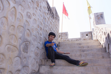 Asia man With Great Wall Of China model at Santichon village 
