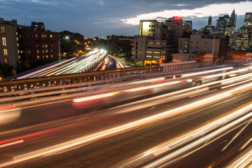 Elevated junction high way asphalt roads with night car traffic lights in the city.