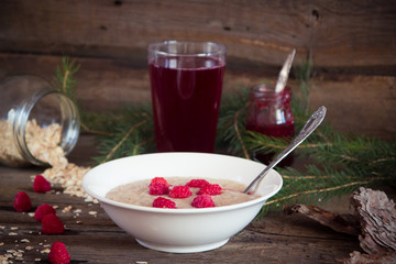 Healthy breakfast, Oatmeal porridge with raspberries and beverag