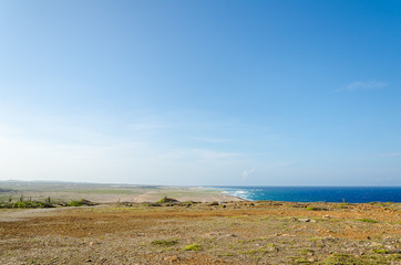 Fototapeta na wymiar Dry and arid desert landscape in Aruba