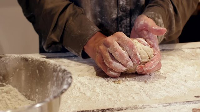 woman baker hand forms pie dough