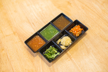 Fototapeta na wymiar Shabu sauce and Condiment for Shabu Shabu,Set of Sauce for Shabu shabu style 