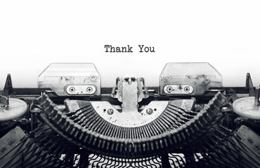 Vintage typewriter on white background with text thank you. © farizun amrod