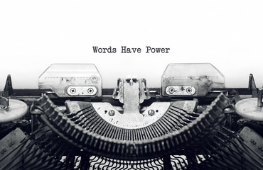 Vintage typewriter on white background with text Words Have Powe - 131267489