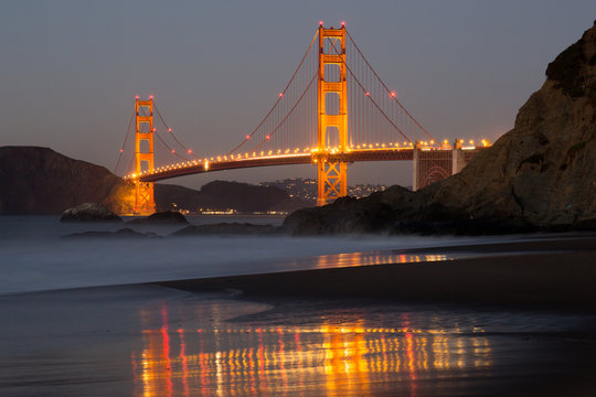 The Golden Gate Bridge and Water Reflection. Baker Beach, San Francisco, California, USA.