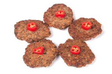 liver pancakes or cutlets with chili pepper isolated on white background