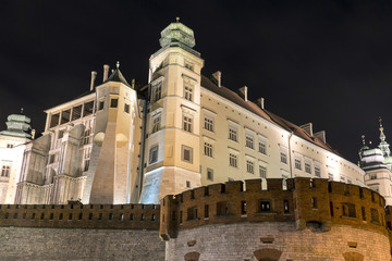 Fototapeta na wymiar View of the illuminated at night Wawel Royal Castle, Krakow, Poland