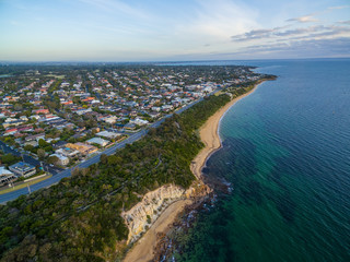 Aerial view of Black Rock suburb and Beach road in Melbourne at sunset. Port Phillip Bay coastline,...
