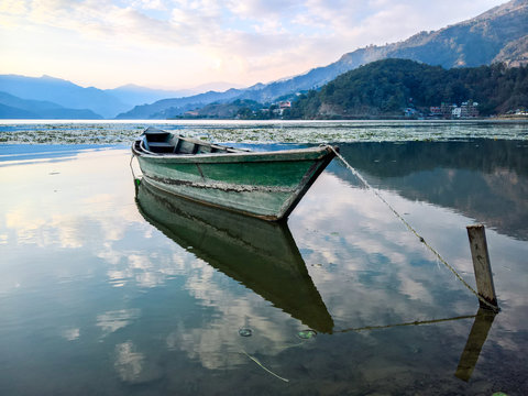 Fototapeta Boat on Lake at Sunset