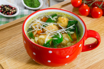 delicious wedding soup with meatball, carrots and spinach