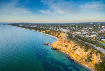 Aerial panorama of Black Rock suburban area and beautiful colorfoll cliffs of the coastline at...
