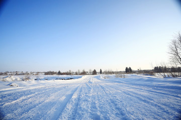 Fototapeta na wymiar snowy road winter landscape