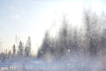 Fototapeta na wymiar blurred winter background with snowflakes for text