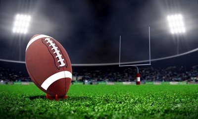 American football in stadium at night with spotlight © razihusin
