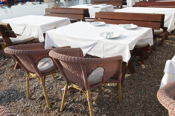 Street cafe on a pebble beach