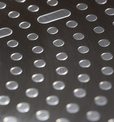 Abstract metal surface. Focus point on the upper part of image.