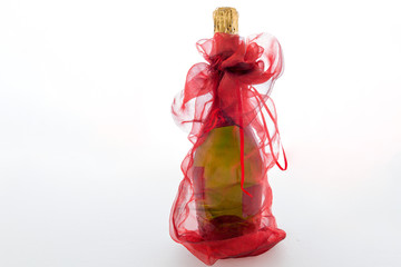 Decorated bottle of champagne on a white background
