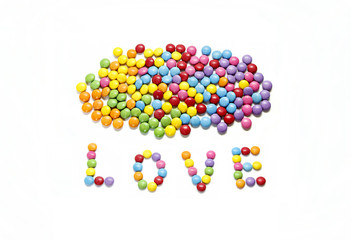 Word ''Love'' and bright colorful candy